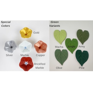 May include: A selection of decorative floral shapes in colours such as gold, silver, copper, and marble. Also shown are green leaf shapes in Macha, Jungle, Army, Olive, and Pine colours. Text labels identify each colour.
