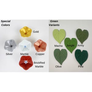 May include: Image showcasing a variety of artificial flower and leaf options. The flowers come in gold, silver, marble, copper, and brick-red marble. The leaves are available in matcha, jungle, army, olive, and pine green variants. Text labels identify each color.