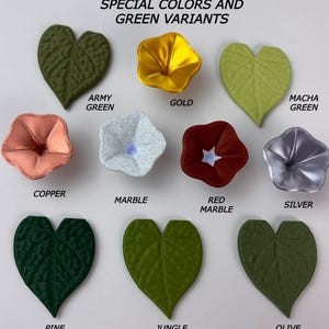 May include: A collection of leaf and flower-shaped objects labeled SPECIAL COLORS AND GREEN VARIANTS. Colors include army green, gold, macha green, copper, marble, red marble, silver, pine green, jungle green, and olive green.