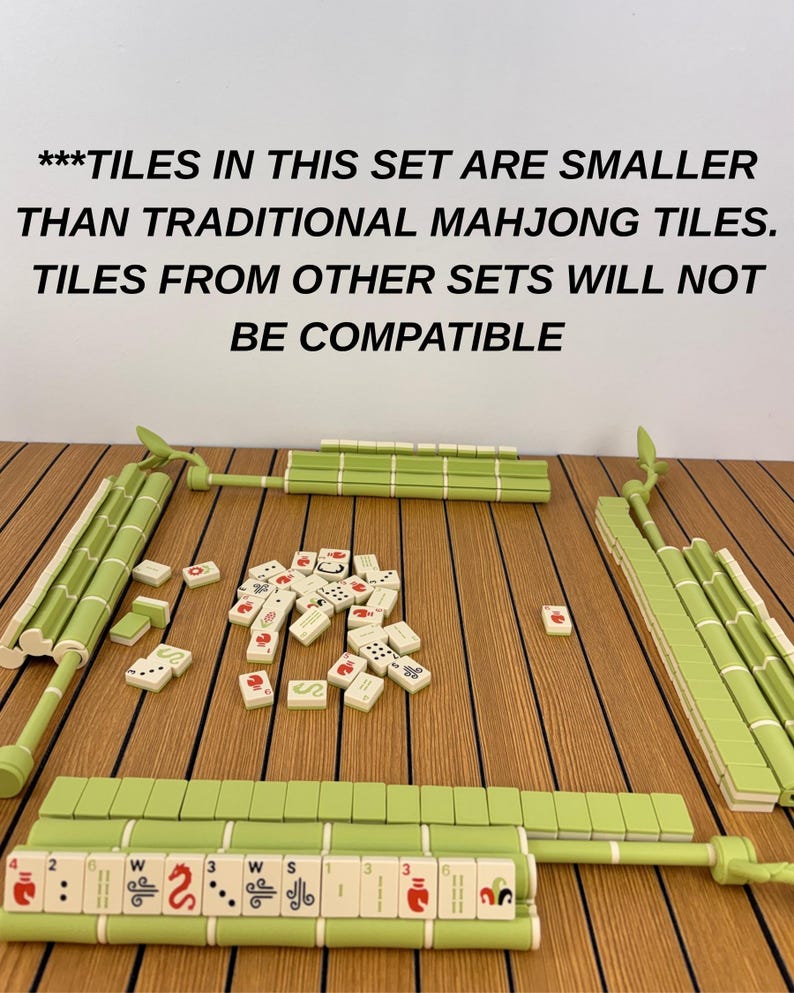 May include: A Mahjong set featuring light green tile racks shaped like bamboo stalks and a collection of small white tiles with red, black, and green markings. Text reads: ***TILES IN THIS SET ARE SMALLER THAN TRADITIONAL MAHJONG TILES. TILES FROM OTHER SETS WILL NOT BE COMPATIBLE
