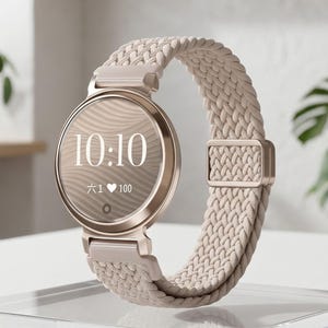 May include: A rose gold smartwatch with a round face displaying the time 10:10. The watch has a beige braided band and is displayed on a clear acrylic stand. The watch face also shows a heart symbol and the number 100.