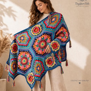 May include: A colourful, handmade crochet shawl with a geometric design and floral patterns. The shawl is in shades of blue, pink, orange, and yellow, with tassels along the edges. The text "Tiny Yarn Tale" and "CROCHET PATTERN PDF" are visible. A cozy, handcrafted item.