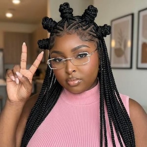 May include: Rimless spectacles featuring clear lenses and a frame embellished with small, sparkling rhinestones along the top and side edges. The spectacles have a lightweight, transparent bridge and thin, metallic arms that rest on the face.