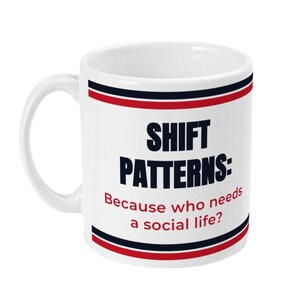 May include: White ceramic mug with the text "SHIFT PATTERNS: Because who needs a social life?" in black and red lettering. The mug has a red, black, and blue border design.