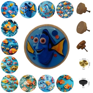 May include: A collection of decorative cabinet knobs featuring various fish designs. Some knobs showcase cartoon fish characters, while others display colorful fish patterns. The knobs are made of wood and metal, with dimensions of D32mm and H20mm.