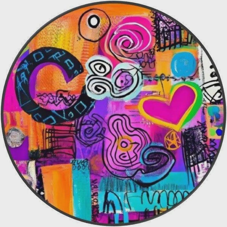 May include: A circular wall art piece featuring a vibrant abstract composition with bold layers of orange, hot pink, purple, and turquoise. The design includes black hand-drawn swirls, a large black crescent shape, and a bright pink heart outline.