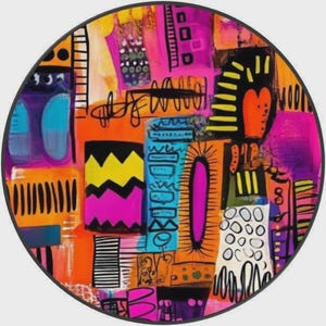 May include: A circular wall art piece featuring a vibrant abstract composition with bold blocks of orange, hot pink, bright blue, and yellow. The design includes black hand-drawn patterns, including zigzags, stripes, circles, and scribbles.