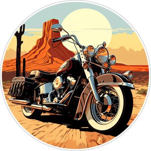 May include: A circular sticker featuring a black cruiser motorcycle parked on a dirt path. The background displays a desert landscape with a large orange rock formation, a tall cactus, and a pale yellow sun in a clear sky, rendered in a graphic style.