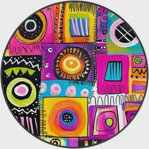 May include: A circular wall art piece featuring a vibrant, abstract composition of geometric shapes and concentric circles. The design incorporates bold blocks of yellow, hot pink, bright blue, and black, accented with white lines and patterns.