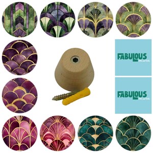 May include: A collection of decorative cabinet knobs with Art Deco designs in shades of green, purple, and gold. A wooden knob with a screw and wall anchor is also included. The text "Fabulous Bits and Dobs" is on a light blue background.