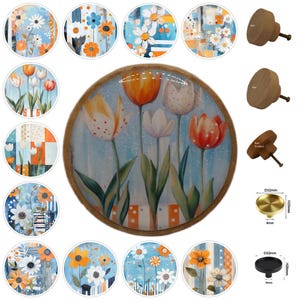 May include: A collection of decorative cabinet knobs and drawer pulls. The image features round knobs with floral designs, wooden knobs, and brass and black metal knobs. The floral designs include tulips and daisies in various colors, set against blue backgrounds.