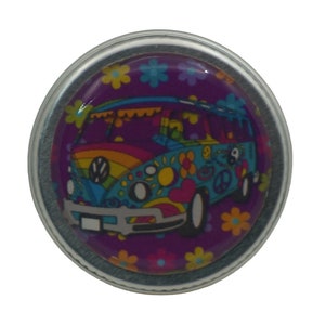 May include: A round, silver-colored pin with a colorful, psychedelic design of a Volkswagen van with peace signs and flowers on a purple background.