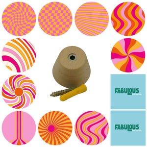 May include: A light-coloured wooden knob with a central metal insert, accompanied by a metal screw and a yellow plastic wall anchor. Surrounding the knob are ten circular patterns in shades of pink, orange, and yellow, plus two blue squares with the text FABULOUS.