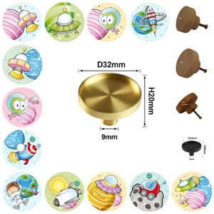 May include: A brass cabinet knob, 3.2cm in diameter and 2cm high, with space-themed stickers. The knob has a circular top and a cylindrical base, 0.9cm in diameter. The stickers depict planets, rockets, and cartoon aliens in vibrant colours.