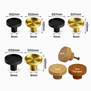 May include: A collection of round cabinet knobs in black, gold, and natural wood finishes. The metal knobs feature labelled dimensions of 22mm, 27mm, and 32mm diameters with 20mm heights. The wooden knobs are labelled with 4cm and 5cm diameters.