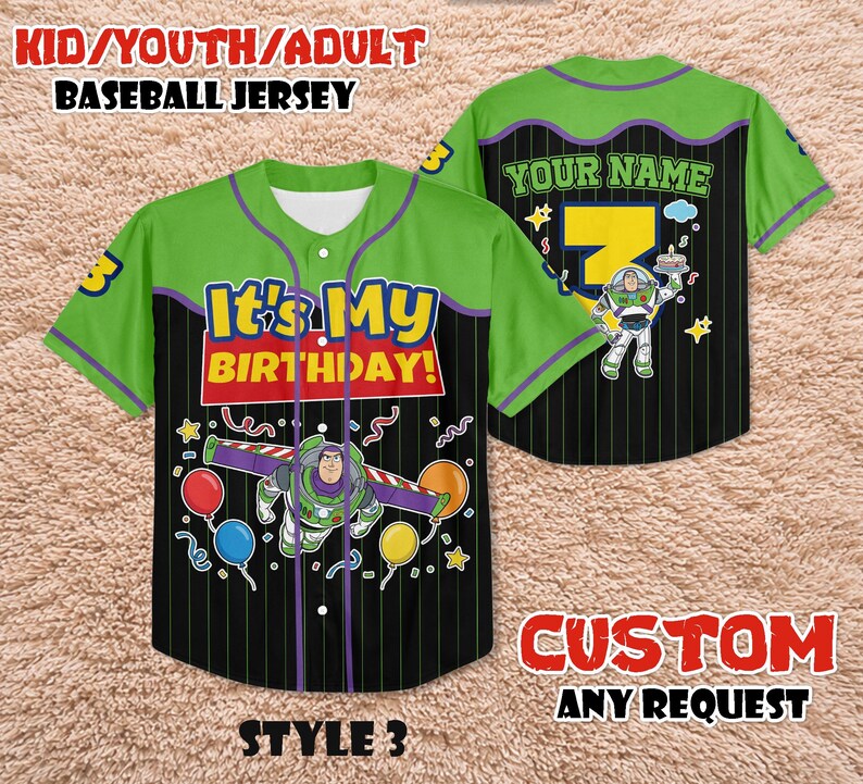 May include: Green and black baseball jersey with the text "It's My Birthday!" and a Buzz Lightyear graphic. The jersey has a button-up front and the text "YOUR NAME" on the back. The jersey is available in youth and adult sizes.