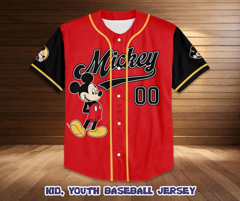 May include: Red baseball jersey featuring Mickey Mouse with the word "Mickey" in black script. The jersey has black sleeves with yellow trim, the number "00", and the text "KID, YOUTH BASEBALL JERSEY".