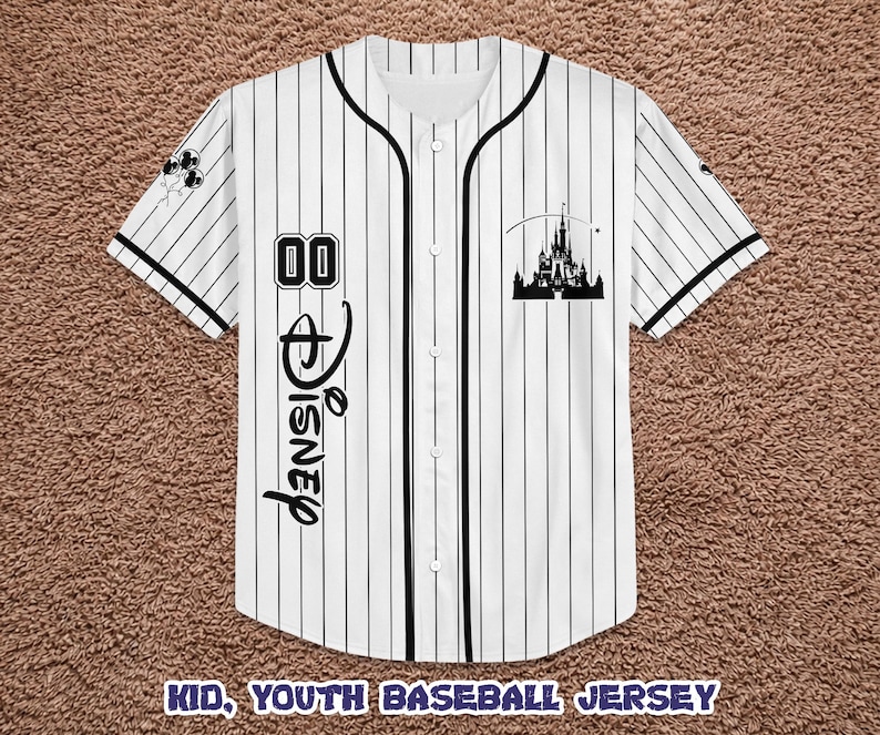 May include: White and black pinstripe baseball jersey with black trim. Features the word "Disney" in script, the number "00", and a castle silhouette. The text "KID, YOUTH BASEBALL JERSEY" is at the bottom.