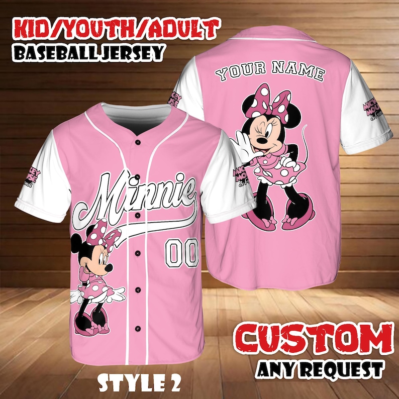 May include: Pink baseball jersey featuring Minnie Mouse with white sleeves. The jersey has the word "Minnie" in script, the number "00", and the text "KID/YOUTH/ADULT BASEBALL JERSEY". The back of the jersey says "YOUR NAME" and "CUSTOM ANY REQUEST".