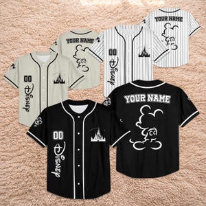 May include: Baseball jerseys in black, white, and beige with Disney-themed designs. The jerseys feature Mickey Mouse graphics, the word "Disney", the number "00", and the text "YOUR NAME".