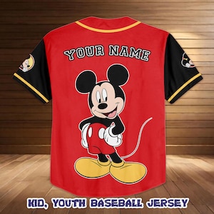 May include: Red baseball jersey with black sleeves and yellow trim. Features a large Mickey Mouse graphic on the front and the text "YOUR NAME" on the back. The bottom of the jersey reads "KID, YOUTH BASEBALL JERSEY".