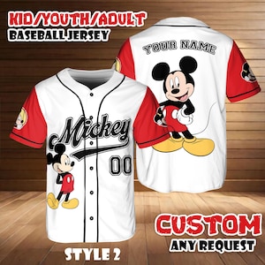 May include: White baseball jersey with red sleeves featuring a Mickey Mouse graphic. The jersey has the word "Mickey" and the number "00" on the front. The back of the jersey has the text "YOUR NAME". The image also includes the text "KID/YOUTH/ADULT BASEBALL JERSEY", "STYLE 2", and "CUSTOM ANY REQUEST".