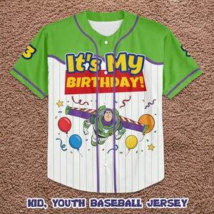 May include: Green and white baseball jersey with the text "It's My Birthday!" and a graphic of Buzz Lightyear. The jersey has purple accents and the number 3 on the sleeve. Balloons and confetti are also featured.