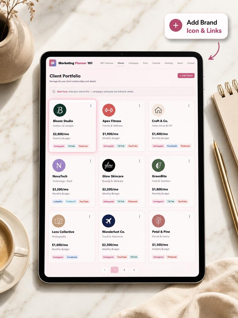 May include: A digital tablet displaying a marketing planner interface. The screen shows a client portfolio with various brand icons and details, including monthly budgets. The interface includes options to add brands and links.