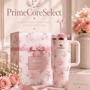 May include: A pink floral-patterned Stanley tumbler with a handle and straw, presented with a matching gift box and ribbon. The text "PrimeCoreSelect" and "LOVESHACKFANCY" are visible. A card reads "Thank you for supporting PrimeCoreSelect."