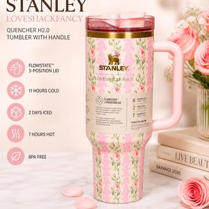 May include: A 40 oz Stanley Loveshackfancy Quencher H2.0 tumbler with handle. The pink and white floral patterned tumbler features a Flowstate 3-position lid and keeps drinks cold for 11 hours and iced for 2 days. The tumbler is BPA free.