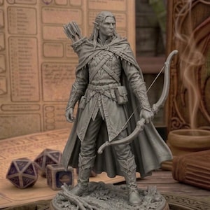 May include: A gray figurine of an elf archer, holding a bow and arrow, with a quiver on his back. The elf is wearing a cloak and detailed armor. Dice and a scroll are in the background, suggesting a fantasy game theme.