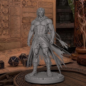 May include: A gray, unpainted resin miniature figure of a muscular warrior standing on a circular base. The figure features a tattered cloak, wrapped footwear, and a scarf. The character has a defined physique and is posed in a standing position.