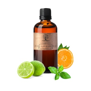 May include: A brown glass bottle with a black cap filled with essential oil. The label reads "Nature's Note 100% Pure Aromatherapy Essential Oil Lime Basil Mandarin naturesnoteorganics.com". The bottle is surrounded by limes, an orange slice, and basil leaves.
