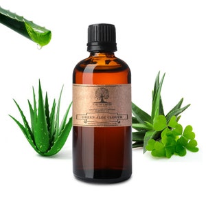 May include: A brown glass bottle with a black cap, labeled "NATURE'S NOTE" and "GREEN ALOE CLOVER". The bottle is surrounded by green aloe vera plants and clover leaves.