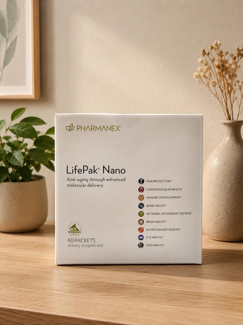 Pharmanex LifePak Nano dietary supplement box placed on a wooden table in a minimalist home setting with soft lighting, indoor plant decor, framed wall art, and a ceramic vase in the background.
