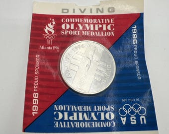 Nuovo gettone sigillato della medaglia olimpica del 1996 per le immersioni.