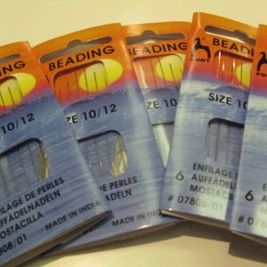 May include: Six packs of Pony Beading needles in size 10/12. The packaging is orange and blue with the text "Beading" and "Size 10/12". The needles are for beading and are made in India.