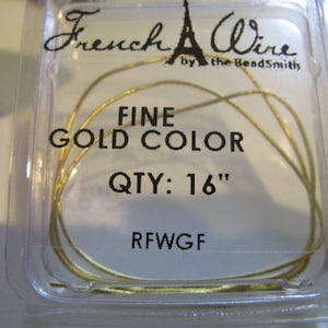 May include: A package of 16 inches of fine gold-colored wire for jewelry making. The package is labeled "French Wire by the Beadsmith", "Fine Gold Color", "QTY: 16"
