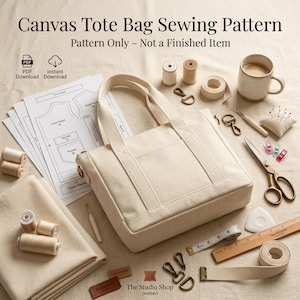 May include: A canvas tote bag sewing pattern with the text Canvas Tote Bag Sewing Pattern and Pattern Only - Not a Finished Item. Includes paper templates, beige fabric, thread spools, metal hardware, scissors, a ruler, and a ceramic mug.