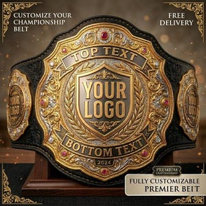 May include: A championship belt featuring a black leather strap and a large, ornate gold and silver metal center plate. The plate displays the text TOP TEXT, YOUR LOGO, BOTTOM TEXT, and 2024, accented with small red gemstones and clear crystals.