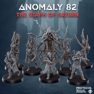 May include: A selection of grey miniature figures, including soldiers and monstrous creatures, on black bases. The text "ANOMALY 82 THE STAPH OF SATURN" is displayed at the top. The figures are 32mm in size.