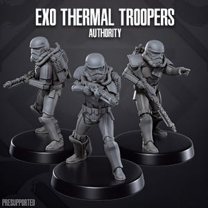 May include: Three grey miniature soldier figurines labeled EXO THERMAL TROOPERS AUTHORITY. Each figure wears a helmet, armor, and a backpack, and holds a rifle. They stand on individual black circular bases. The text PRESUPPORTED is visible.