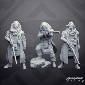 May include: Three grey miniature figures in hooded cloaks and tactical gear, each holding a long rifle. The central figure stands on a rock, while the others stand on flat ground. The text "PRESUPPORTED" is visible in the bottom right corner.