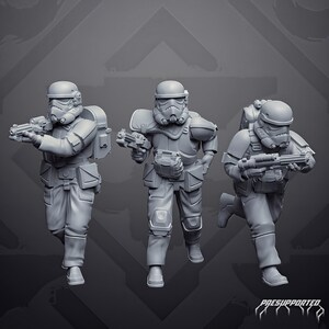 May include: Three grey miniature soldier figurines in tactical gear and helmets, each holding a blaster rifle. The figures are depicted in dynamic running poses, wearing detailed armour with pouches, backpacks, and knee pads. The text PRESUPPORTED is visible.