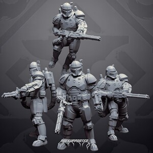 Könnte beinhalten: Ein Set aus vier grauen Miniaturfiguren, die gepanzerte Krieger mit Helmen darstellen, jeweils ausgestattet mit einem schweren Blastergewehr und einem Rucksack. Die Figuren zeigen detaillierte taktische Panzerung, Gürtel und Handschuhe. Der Text PRESUPPORTED ist sichtbar.