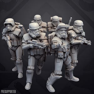 May include: A group of five unpainted grey miniature soldier figurines in tactical armour and helmets, each holding a blaster rifle. The figures are posed in a dynamic formation, with some wearing backpacks and utility gear. The text PRESUPPORTED is visible.