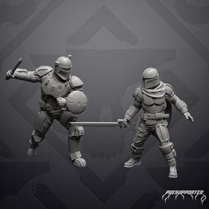 May include: Two gray resin miniature figures in full tactical armor and helmets. The left figure holds a short blade and a round shield. The right figure holds a long sword. Both wear detailed chest plates, belts, and leg armor. Text reads PRESUPPORTED.