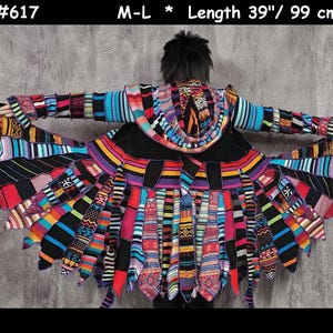 May include: A vibrant, patchwork-style coat with a hood, featuring a kaleidoscope of colors and patterns. The coat's length is 39 inches (99 cm). The design incorporates stripes, geometric shapes, and various textures, creating a unique and artistic garment.