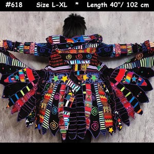May include: A black coat with a multi-coloured patchwork design featuring various patterns, stripes, and star shapes. The garment has a flared, jagged hemline and long sleeves. Text at the top reads #618, Size L-XL, and Length 102 cm.