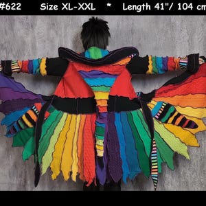 May include: A multi-colored hooded coat featuring a patchwork design of various knit textures and vibrant hues including red, orange, yellow, green, blue, and purple. The garment is labeled #622, size XL-XXL, and has a length of 41 inches.